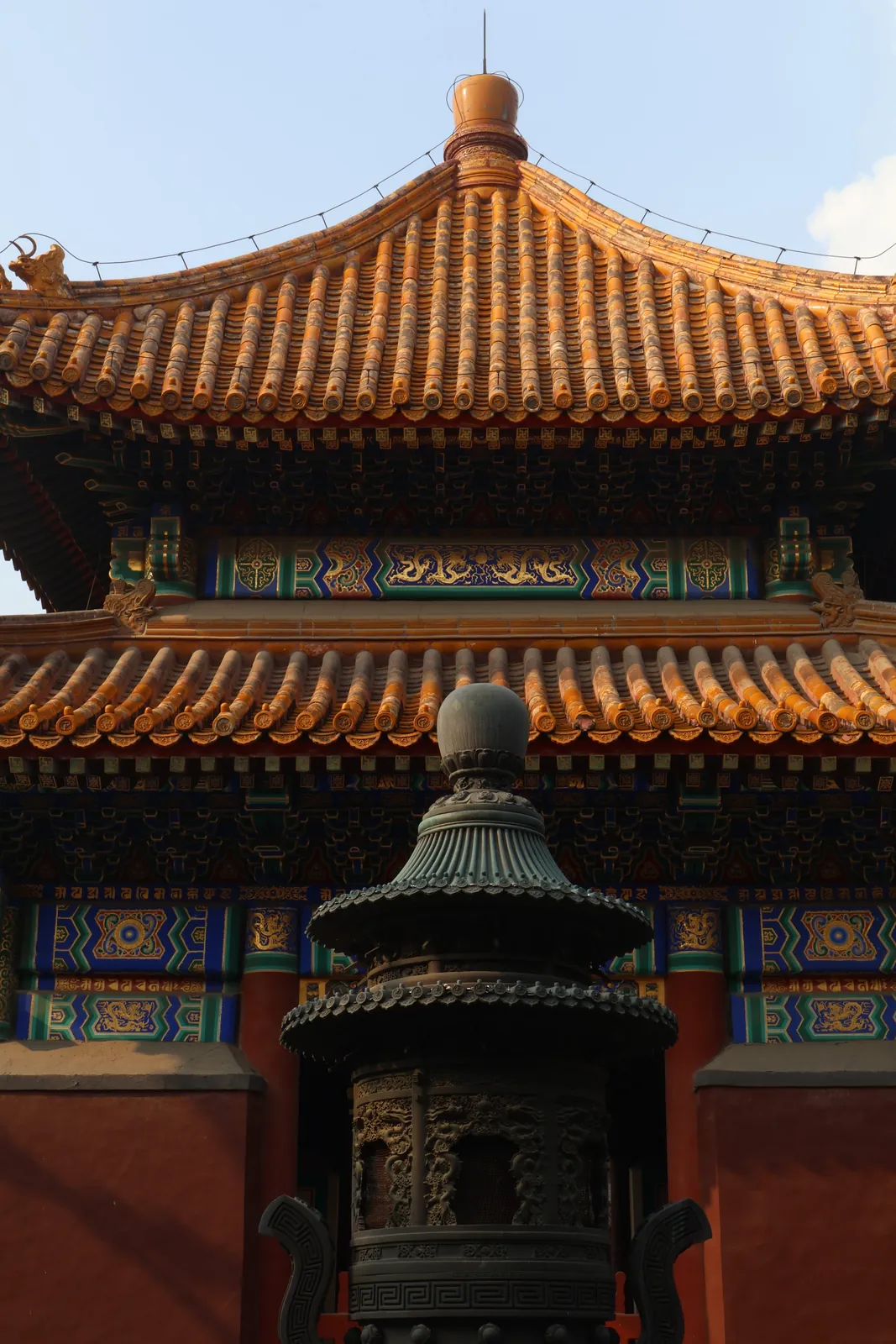 A yellow-tiled imperial roof against the sky
