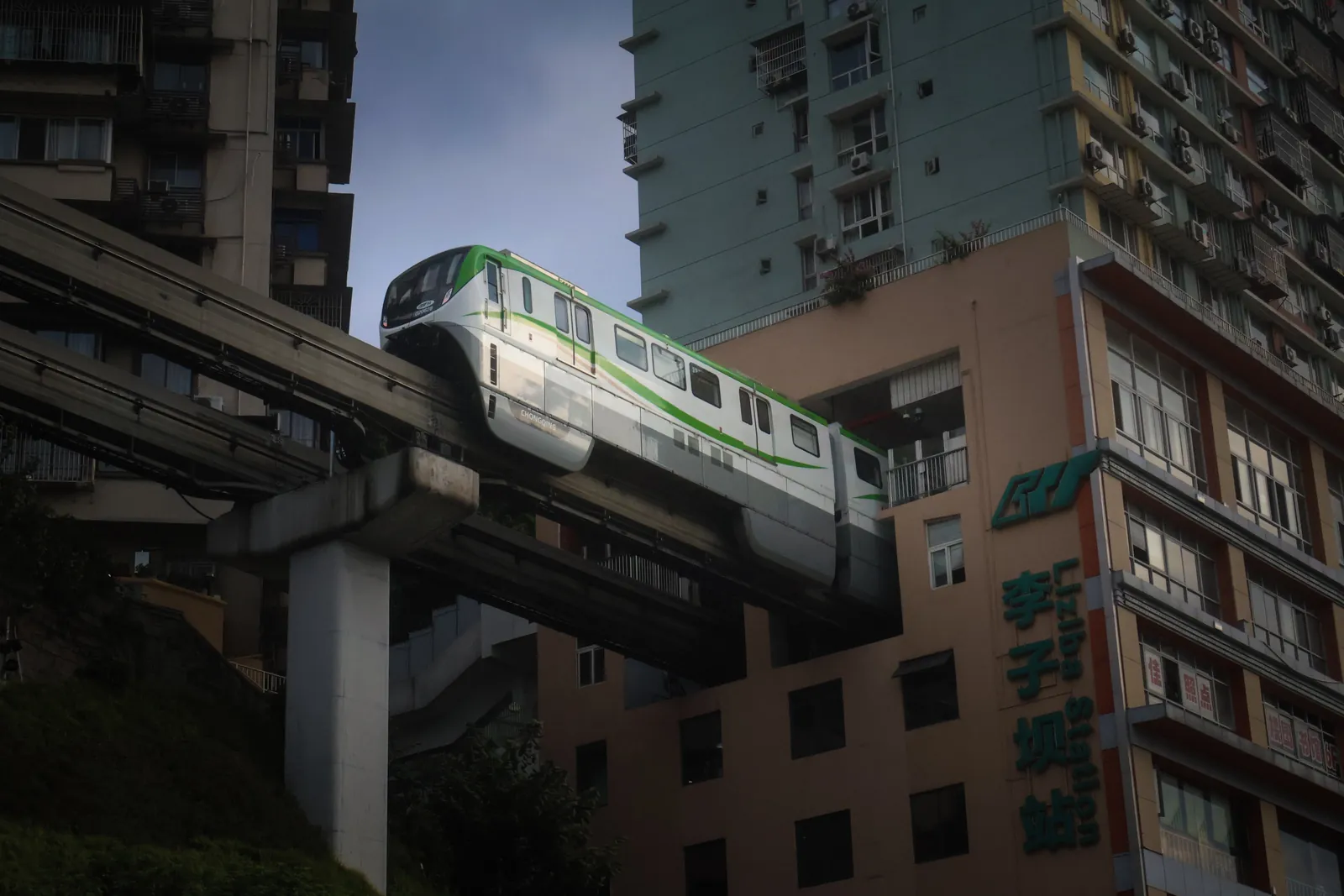 The Liziba monorail coming out of an apartment building